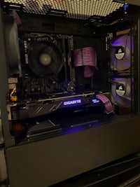 the inside of a computer case with a purple light on it